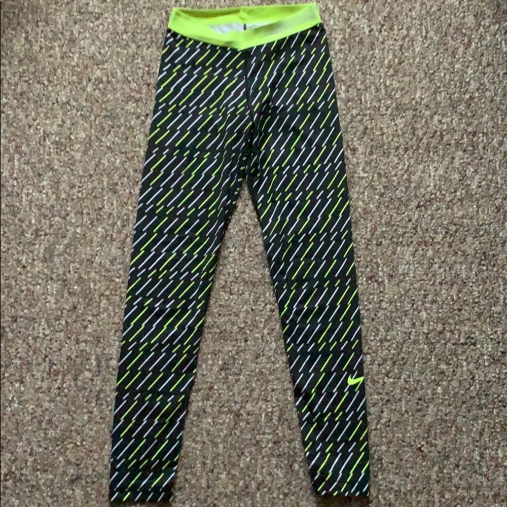 Nike pro leggings with yellow and white design.